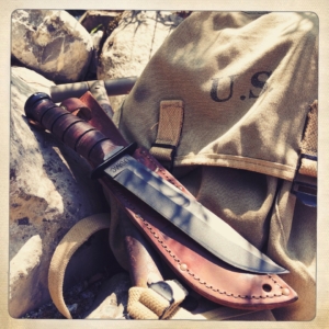 A photo of the gorgeous Ka-Bar knife out in the field as part of an outdoor kit.