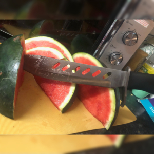 Knives are tools! Slicing up a melon with a fixed blade knife.